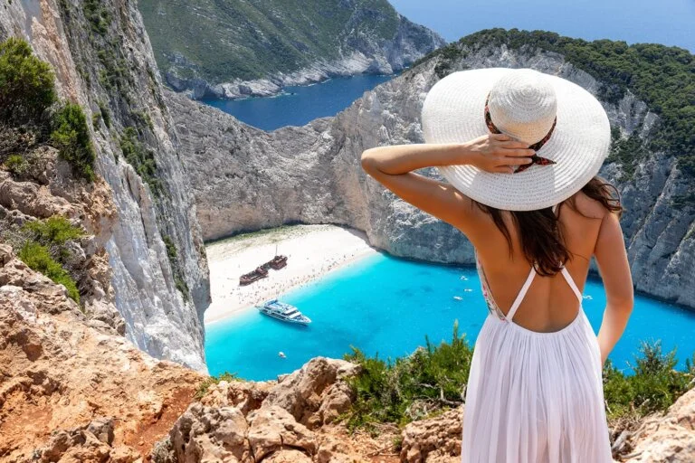 woman-view-navagio-beach-zakynthos-greece-shutterstock_1432835525 source:https://www.roadaffair.com/best-things-to-do-in-zakynthos-greece/